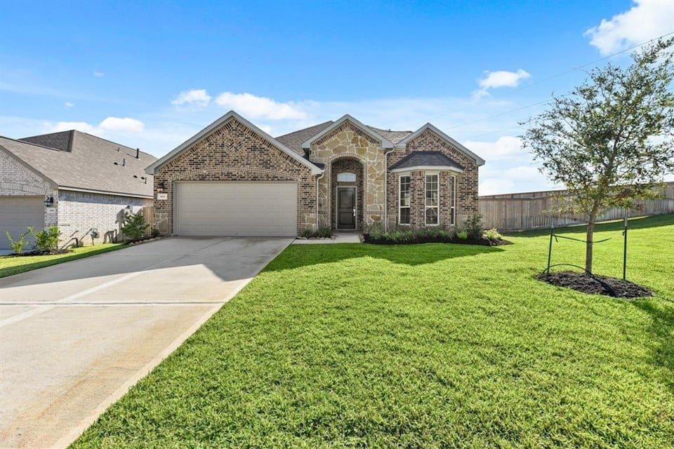 A large house with a driveway.