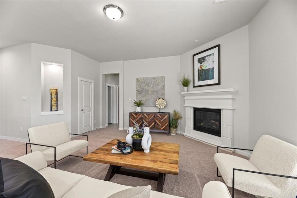 A living room with a fireplace.