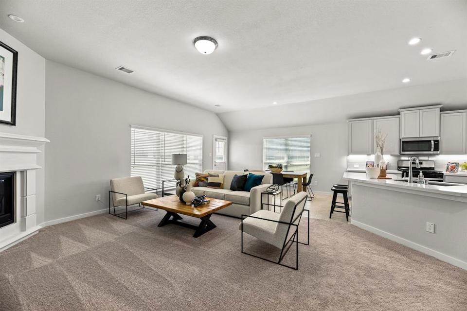 A living room with a couch and a table.