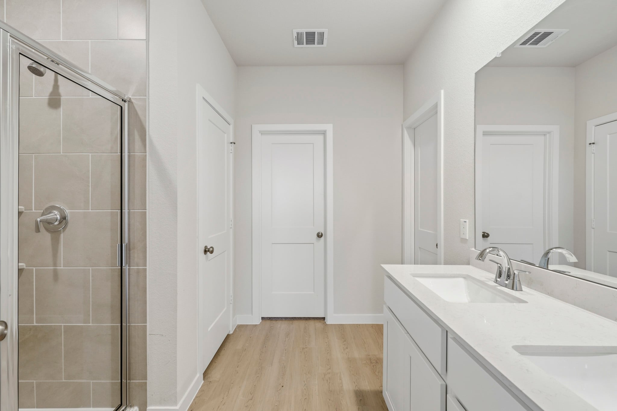 A bathroom with a glass shower.