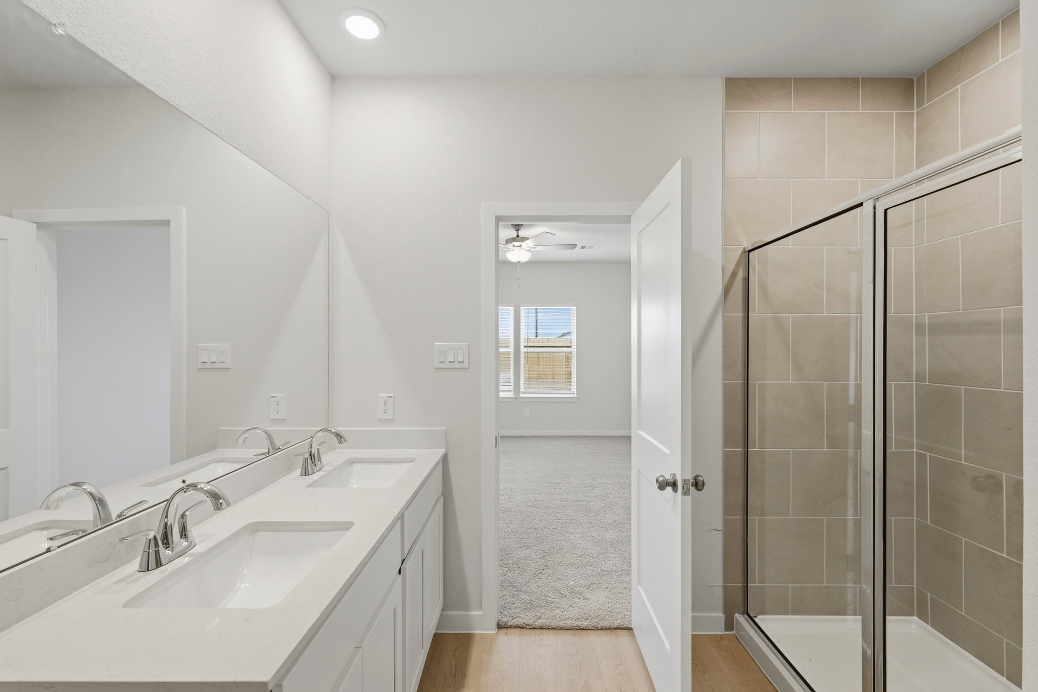A bathroom with a glass shower.