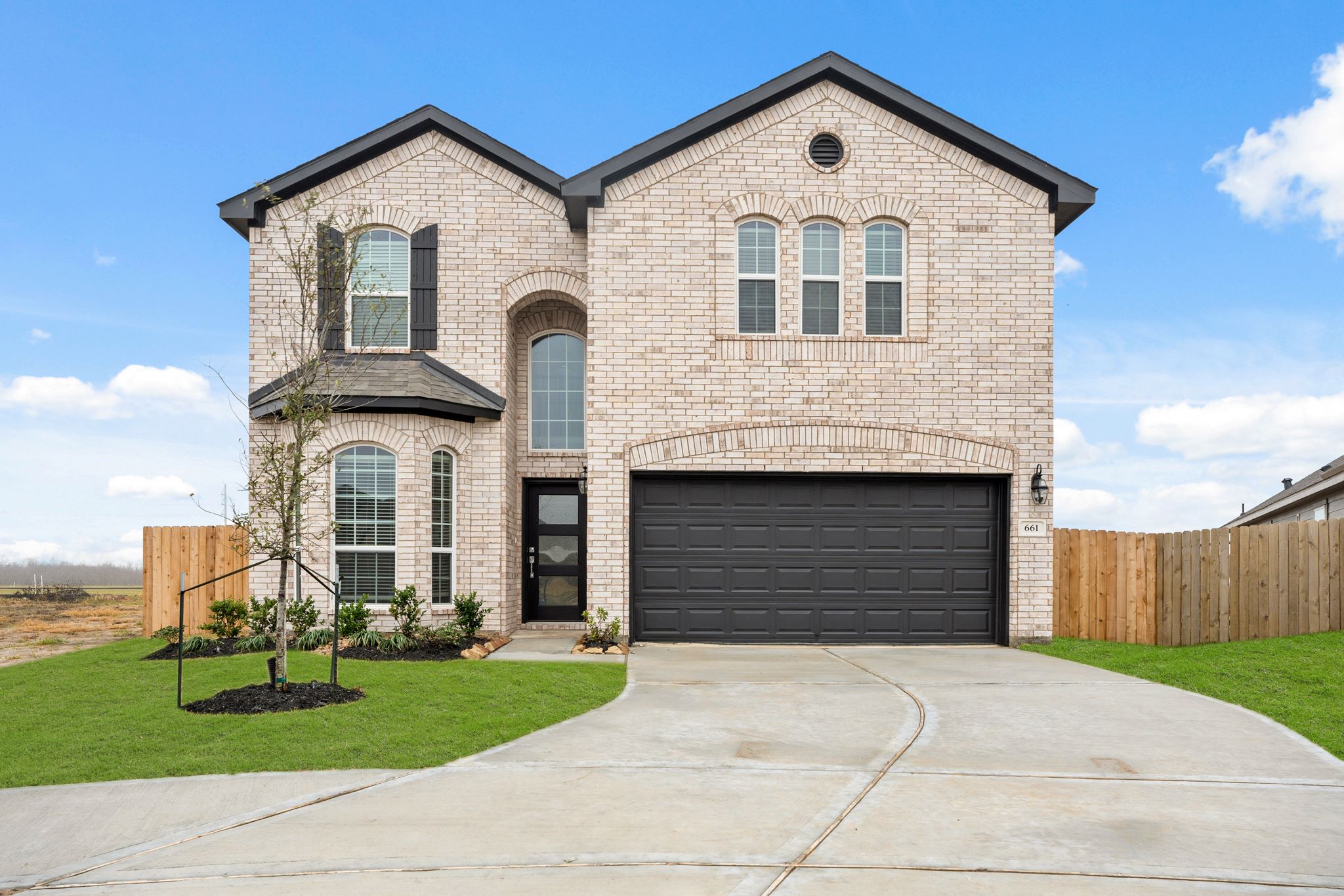 A large brick building with a garage.