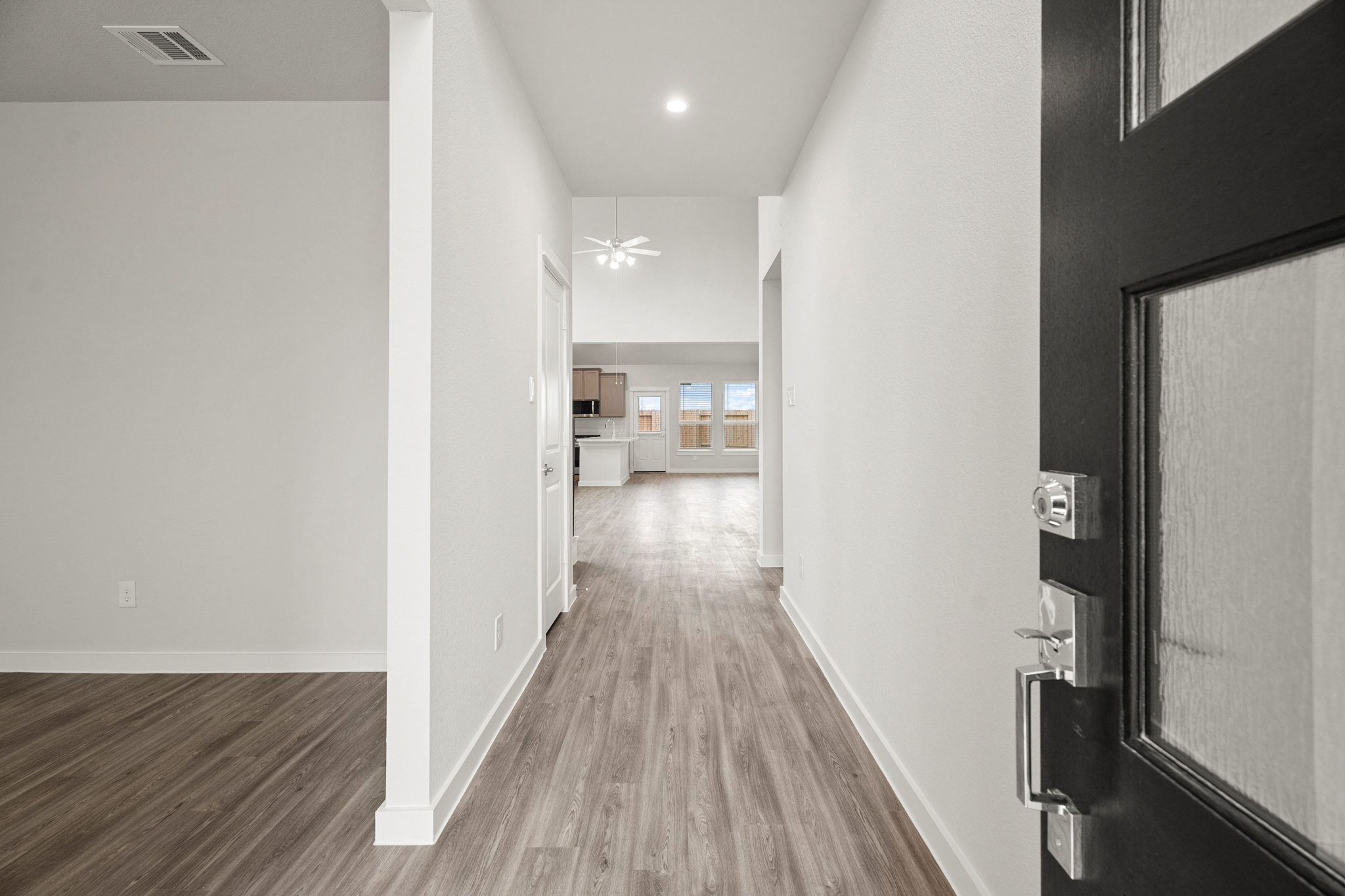 A hallway with white walls.