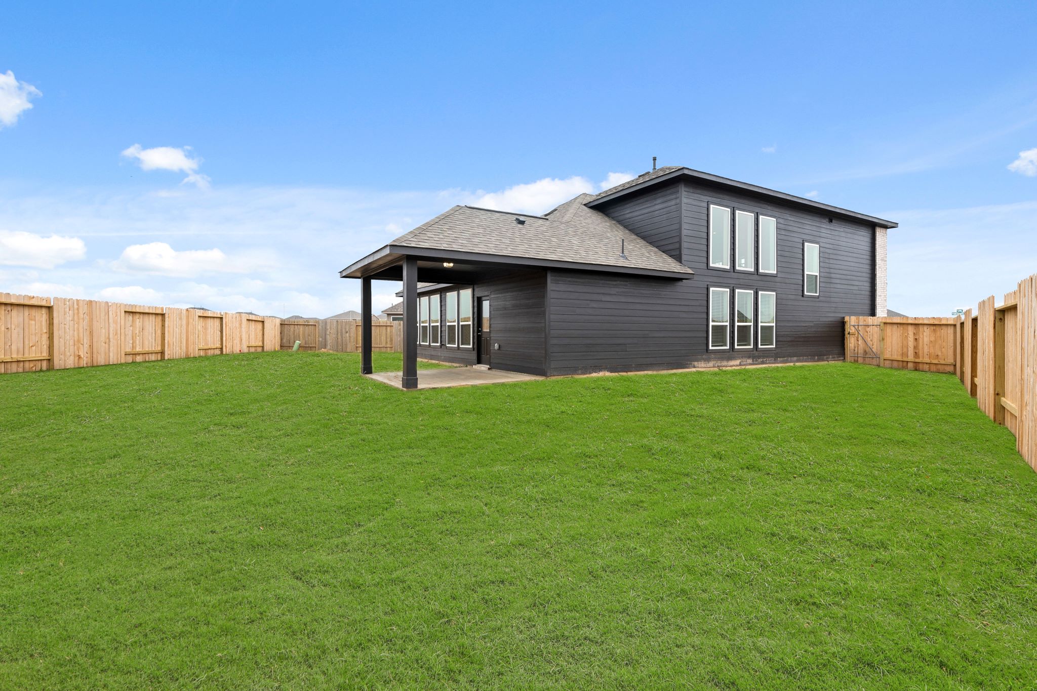 A house with a grass yard.