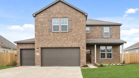 A brick house with a garage.