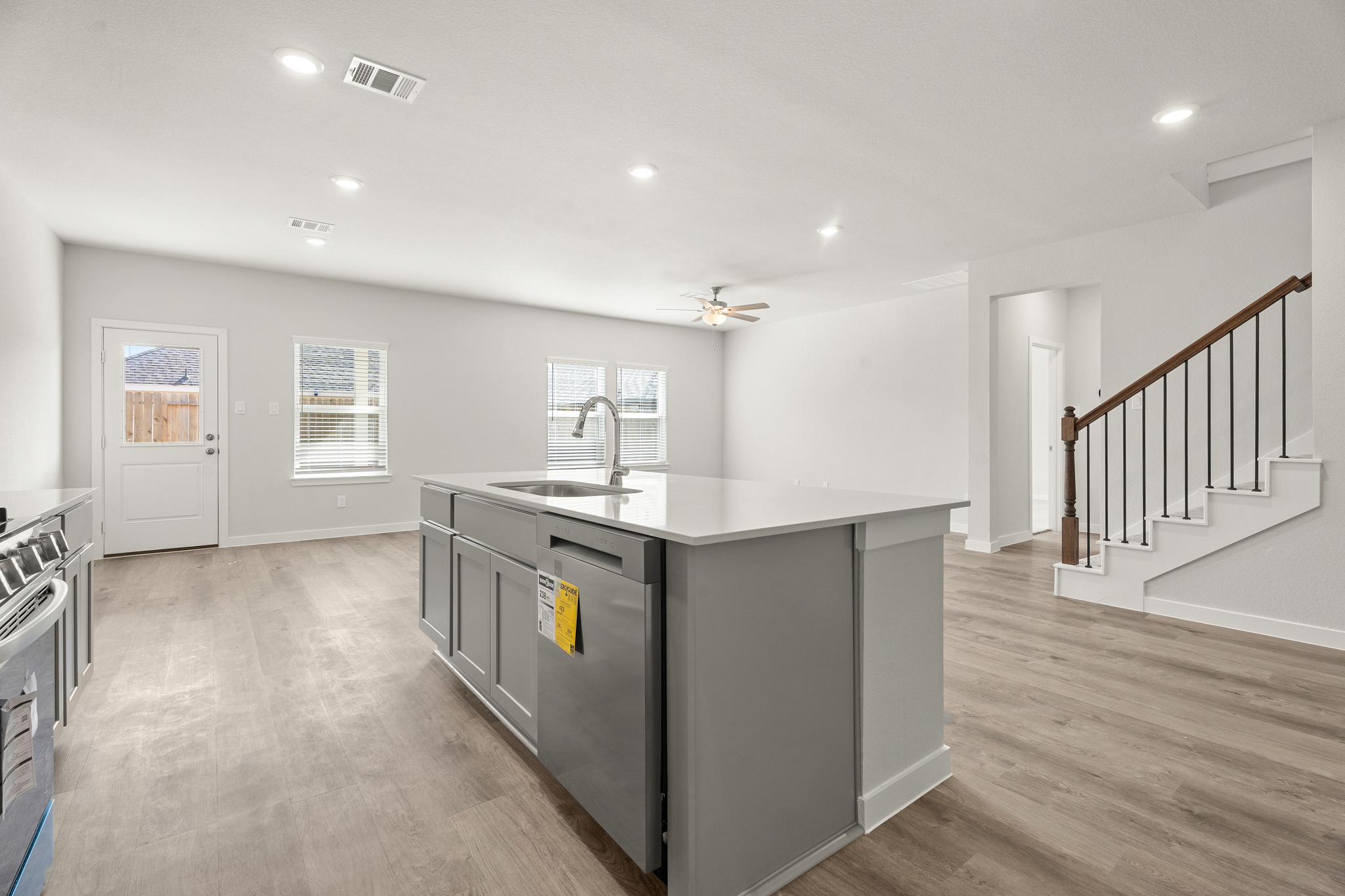 A kitchen with a wood floor.