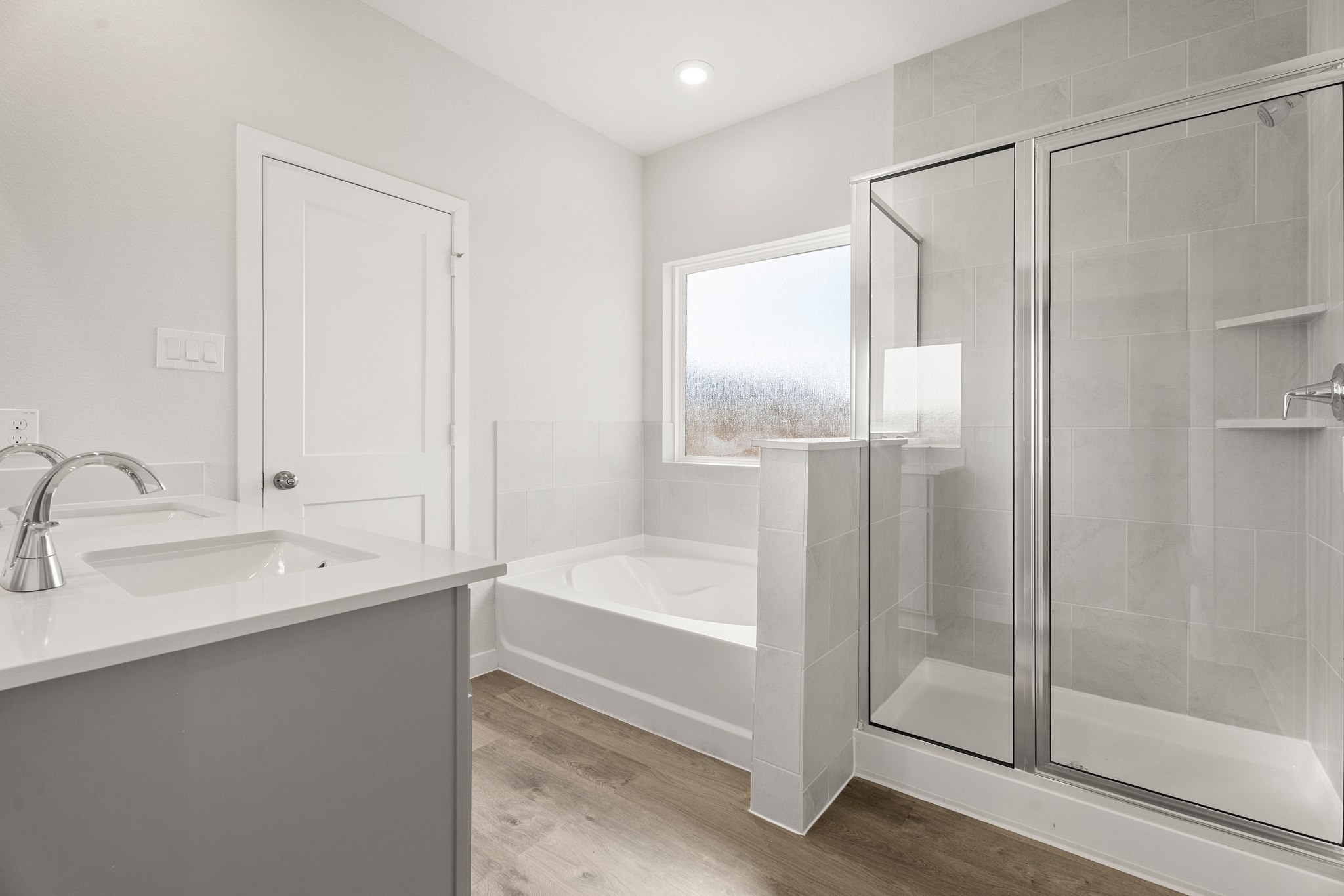 A bathroom with a glass shower.