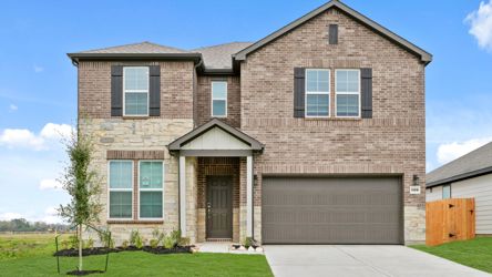 A brick house with a garage.
