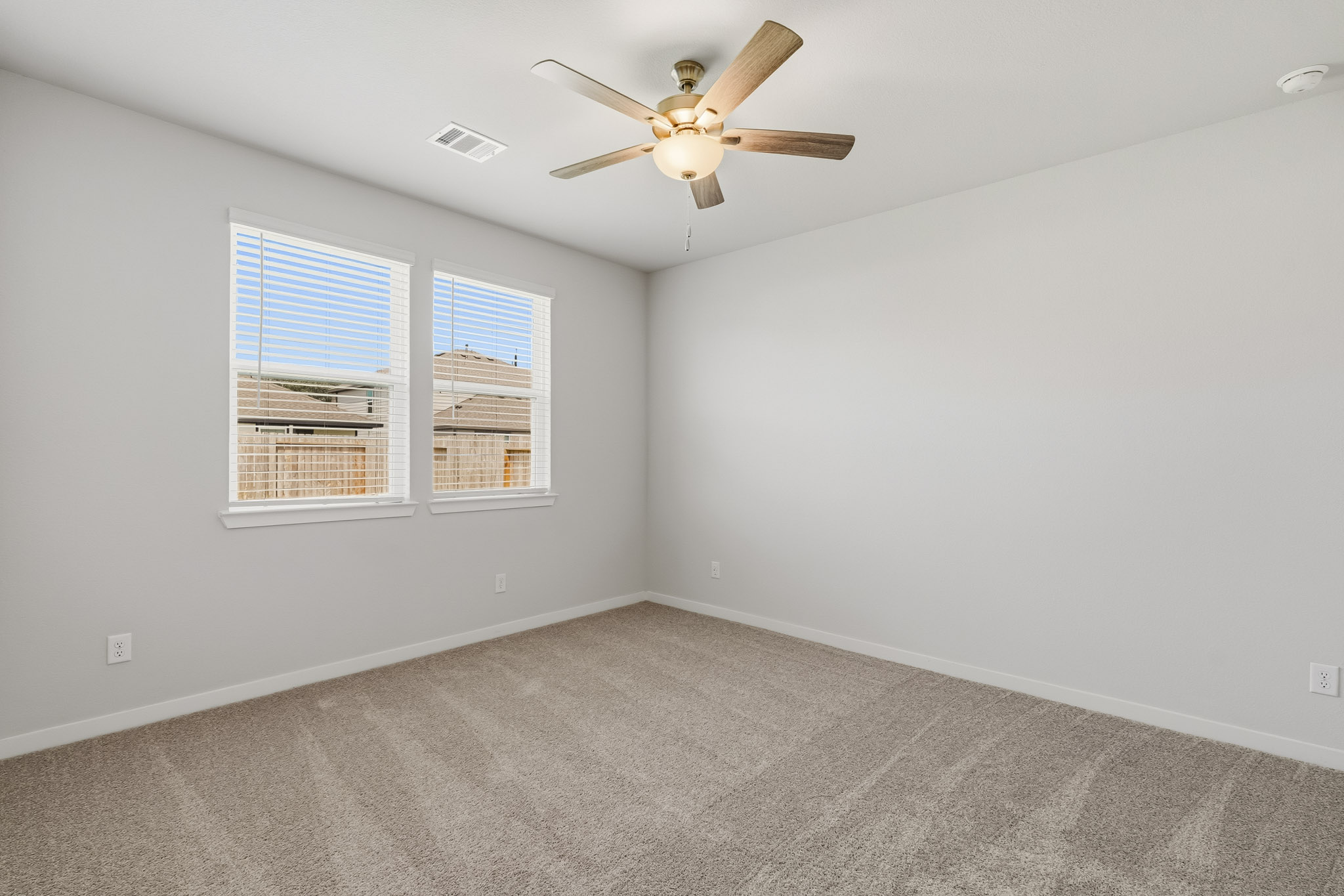A ceiling fan in a room.
