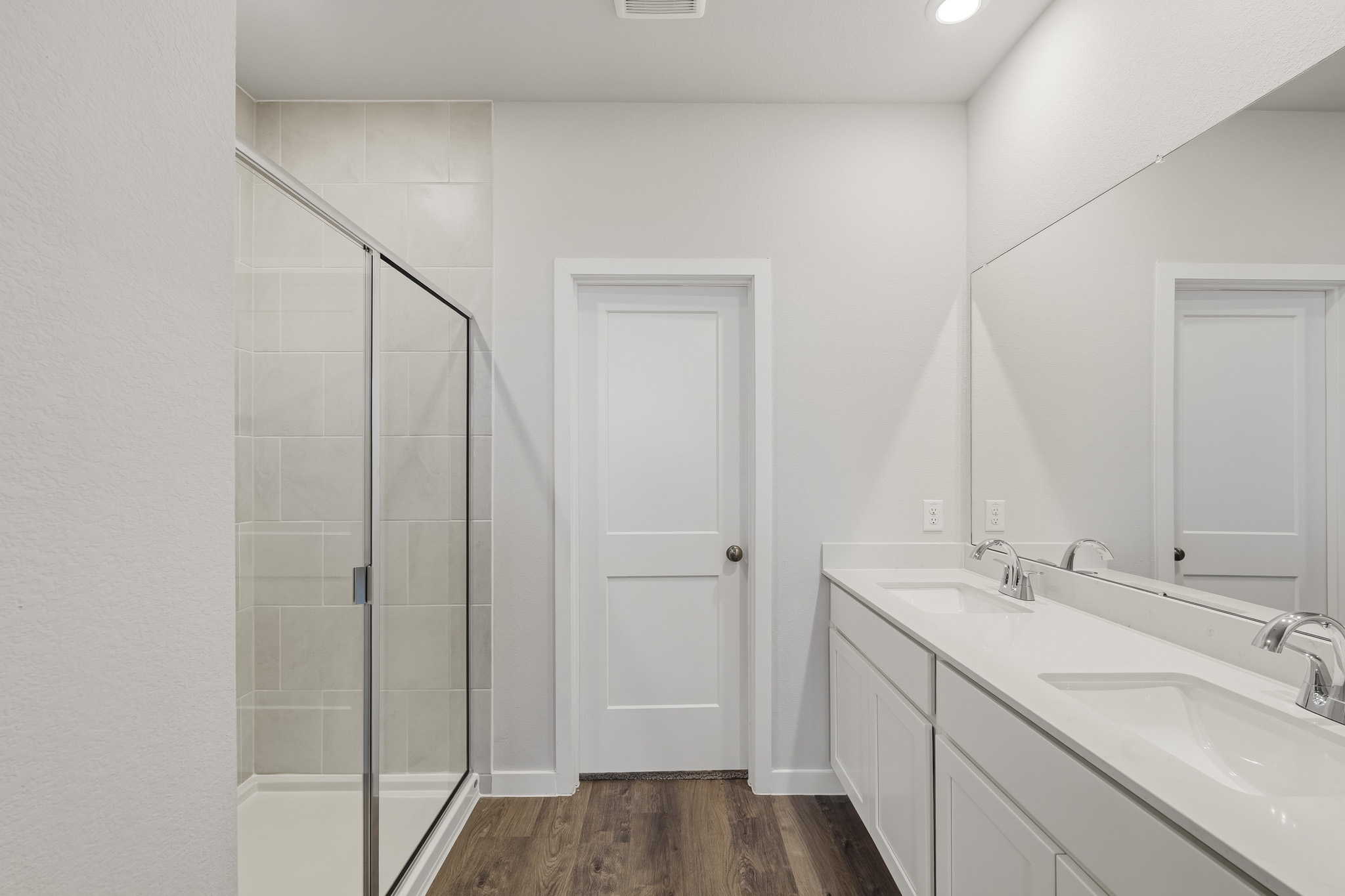 A bathroom with a glass shower.