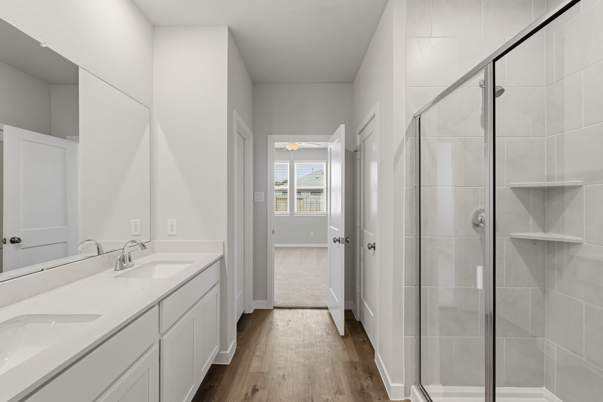 A bathroom with a glass shower.