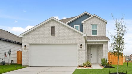 A house with a garage with American Gothic House in the background.