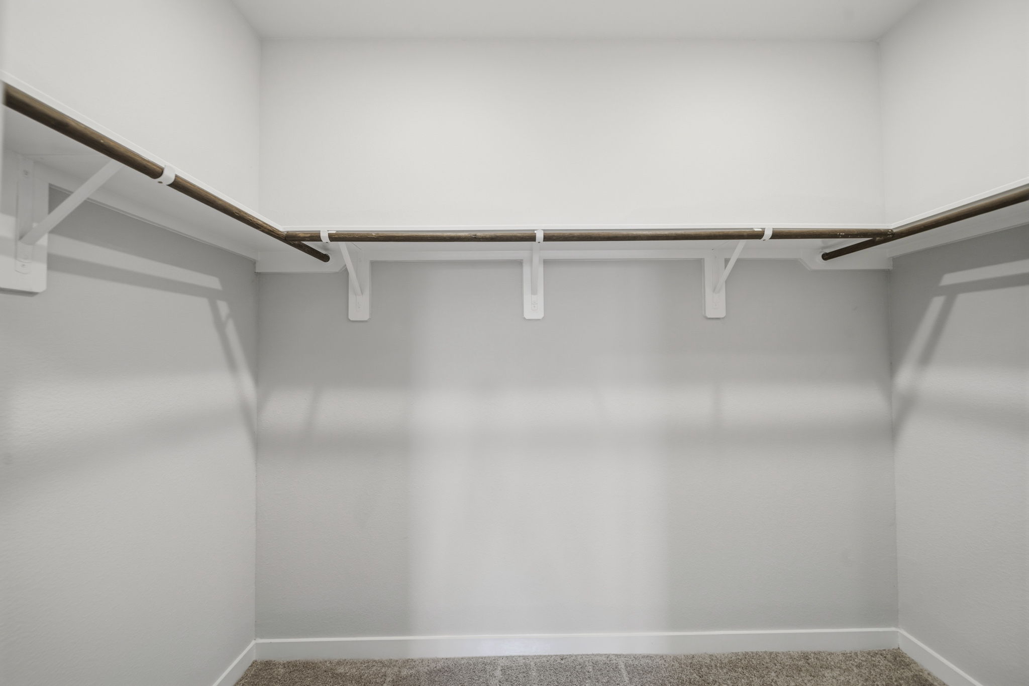 A white staircase with white walls.