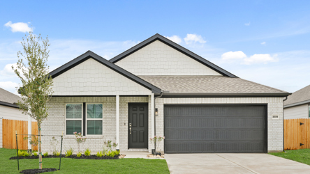 A house with a garage with American Gothic House in the background.