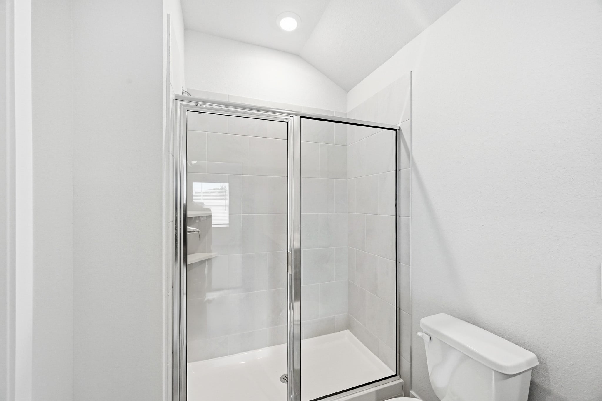 A bathroom with a glass shower.