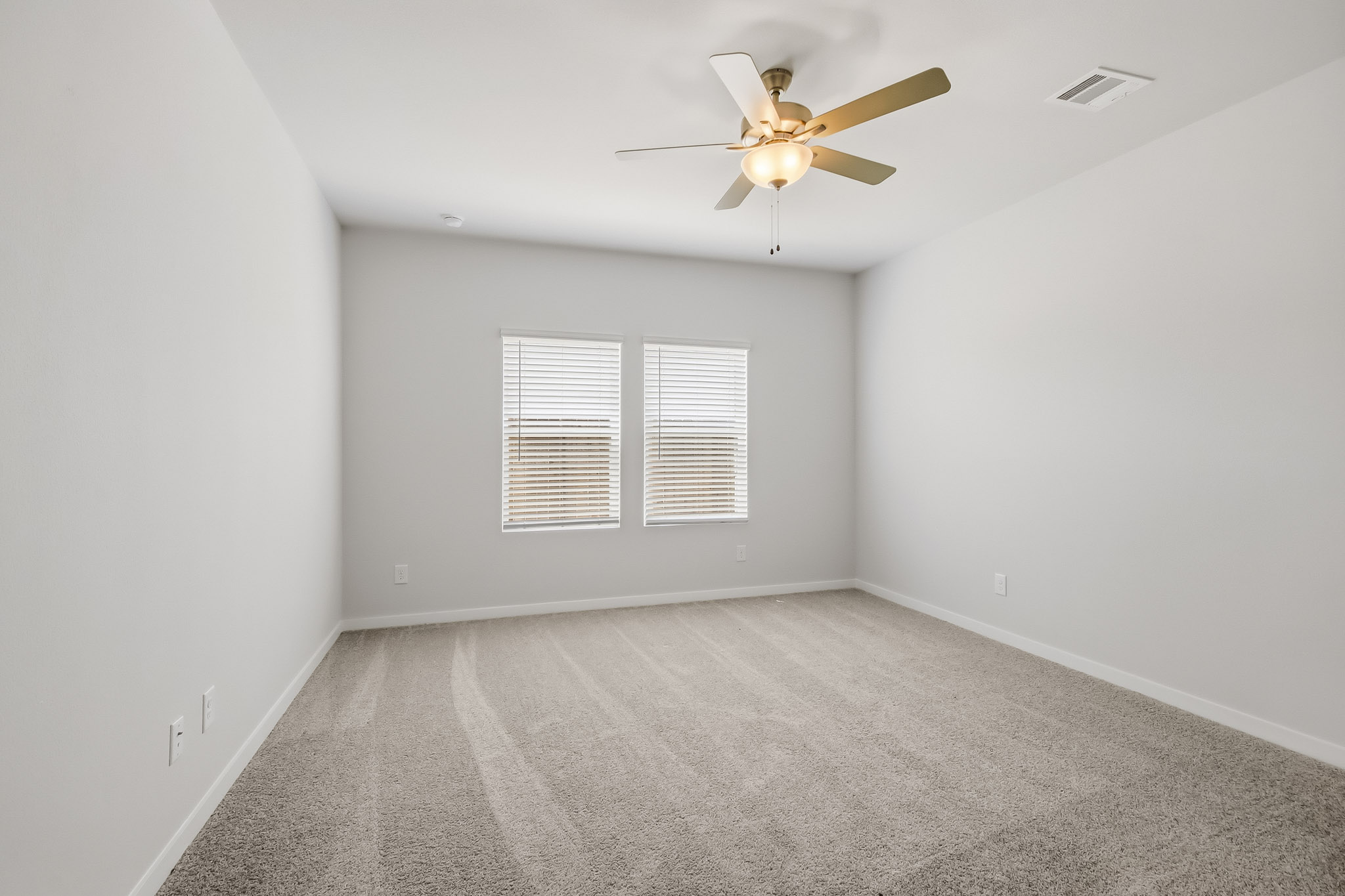 A ceiling fan in a room.