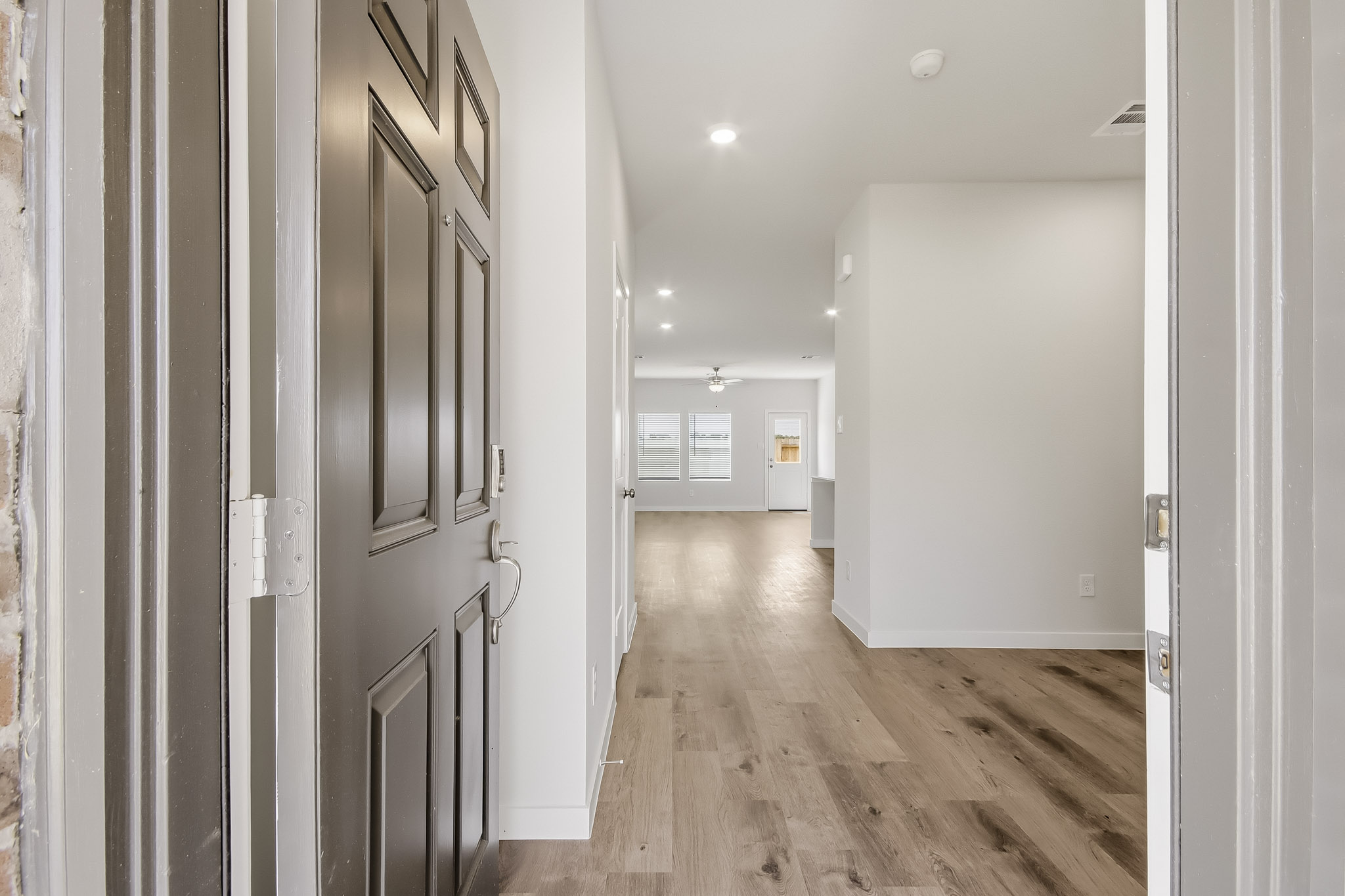 A hallway with white doors.