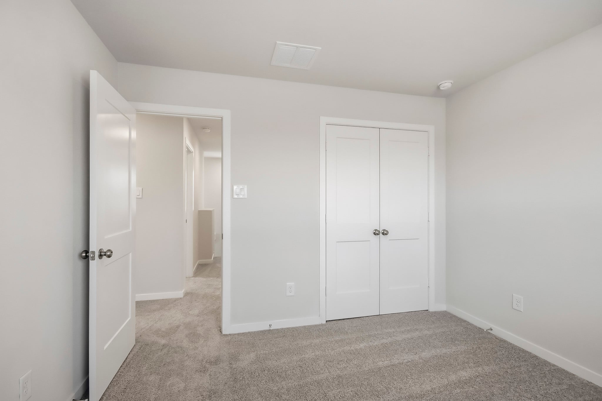 A room with white doors.