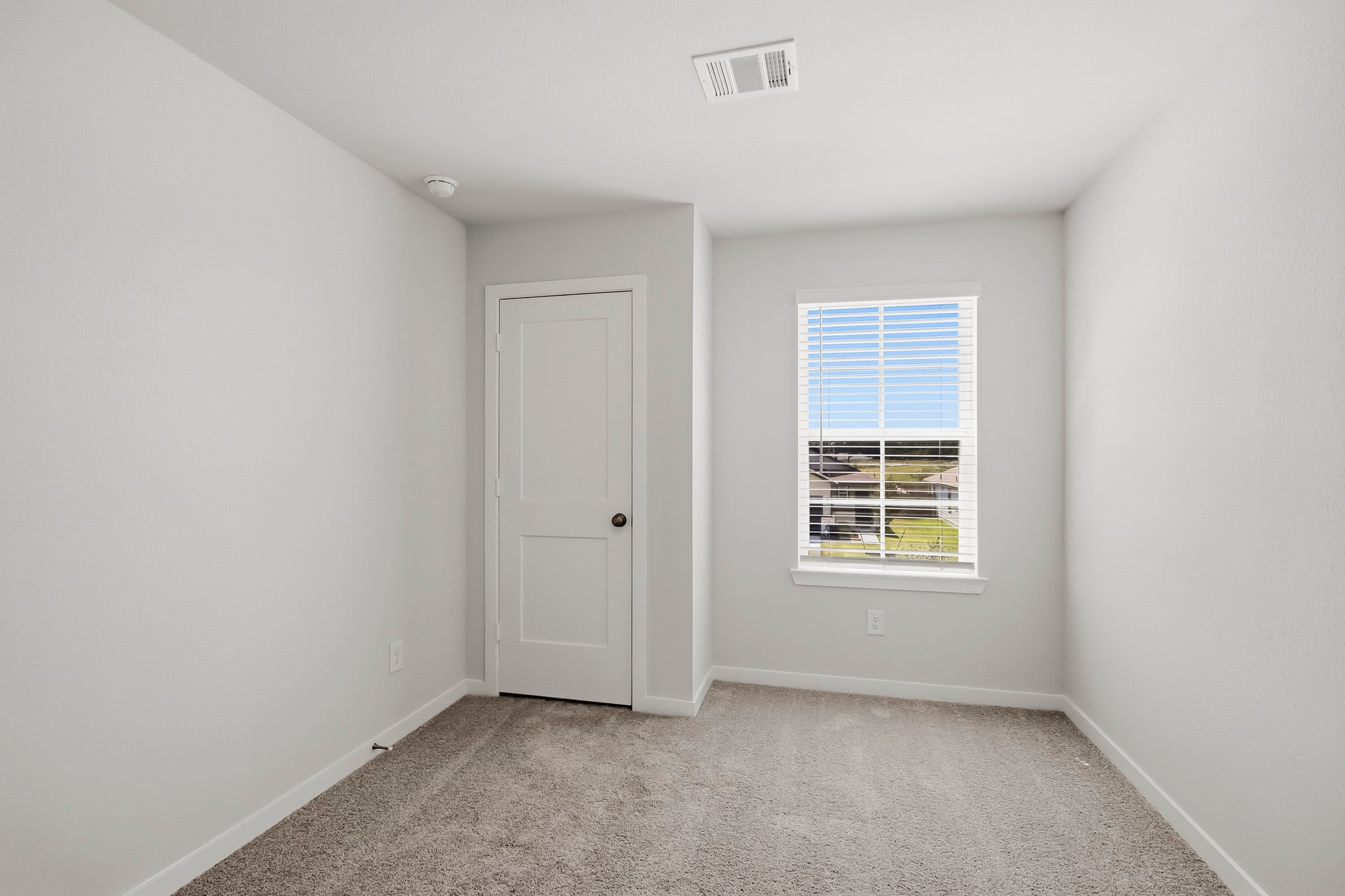 A room with a door and a window.