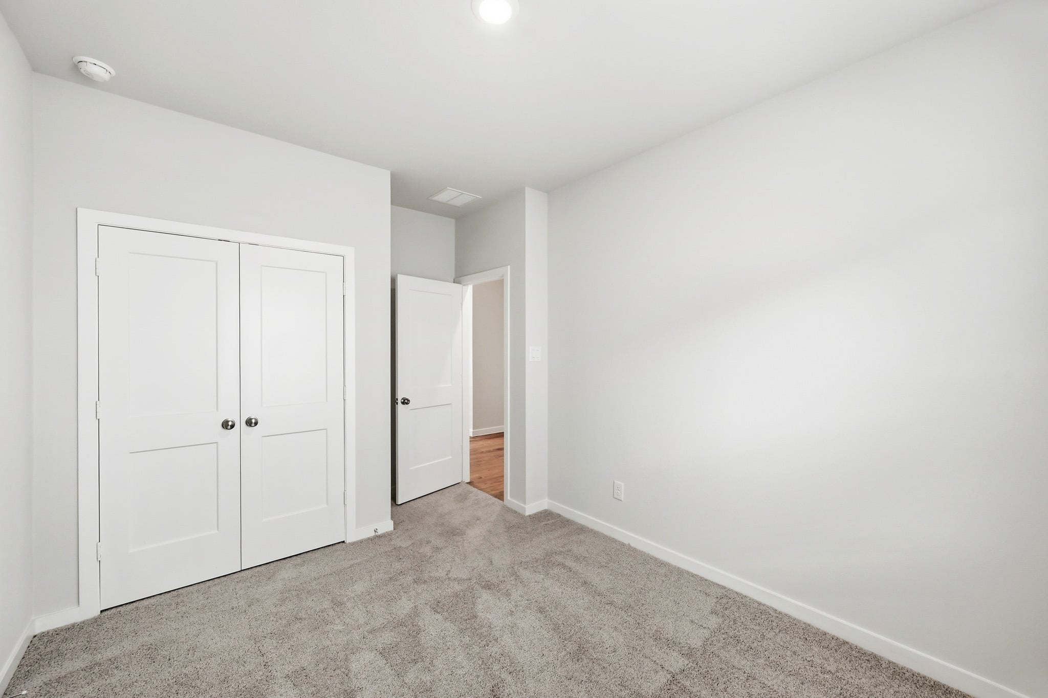 A room with white doors.