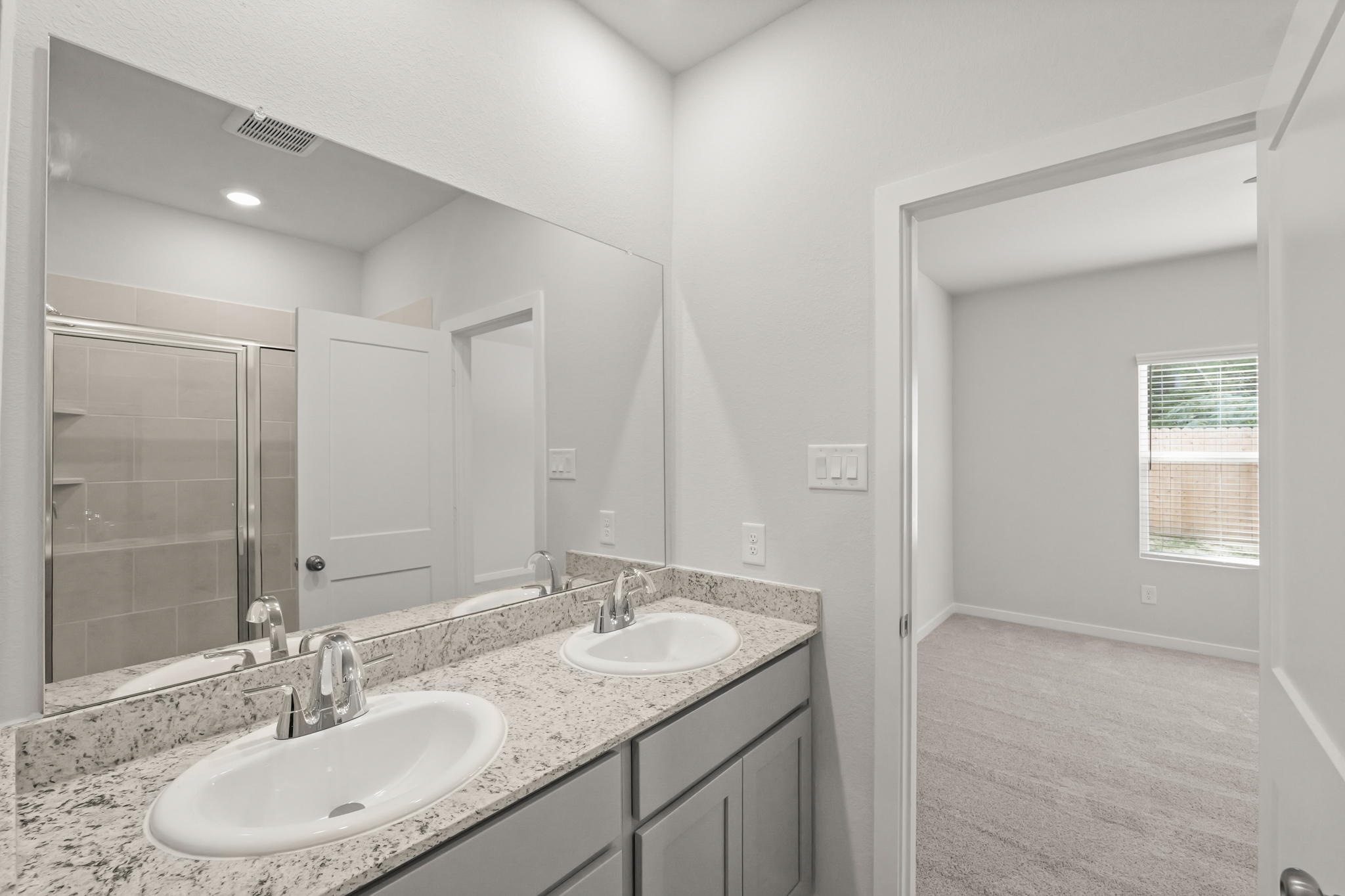 A bathroom with two sinks.