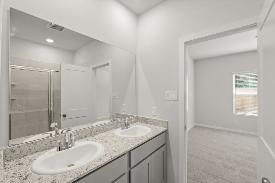 A bathroom with two sinks.