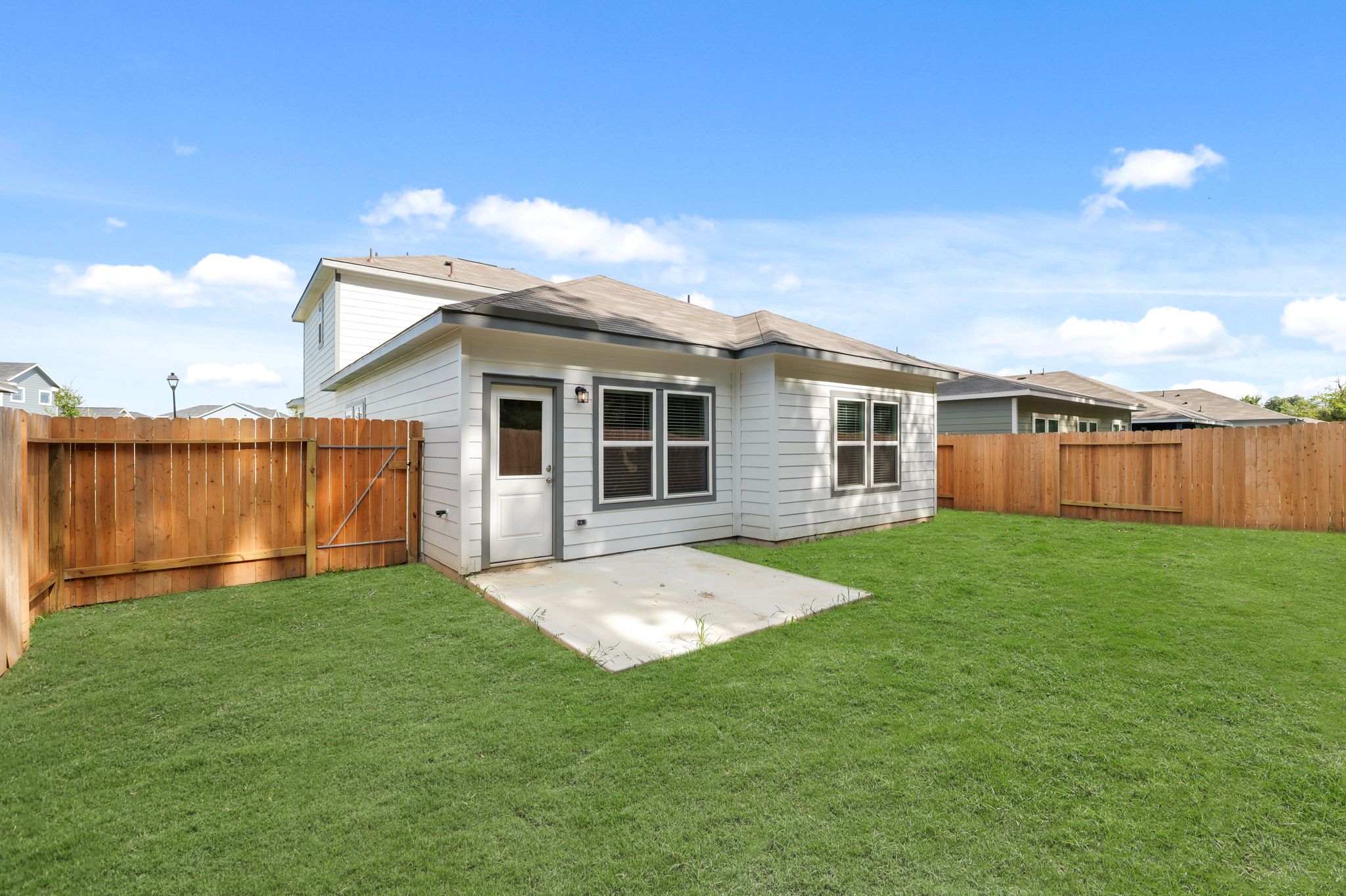 A small house with a fence.