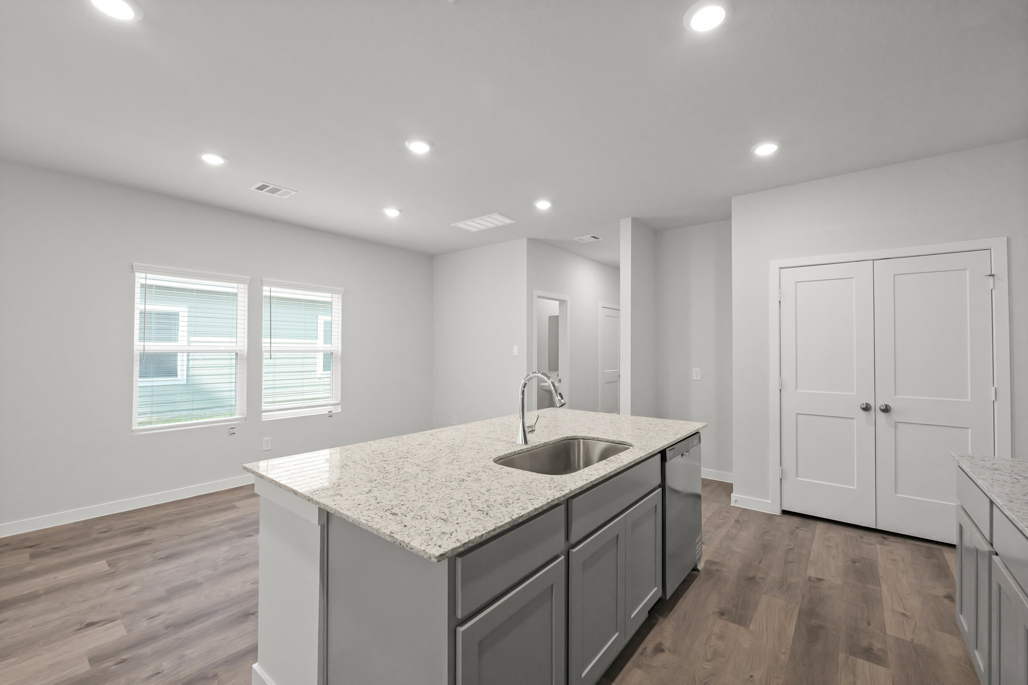 A kitchen with a marble countertop.