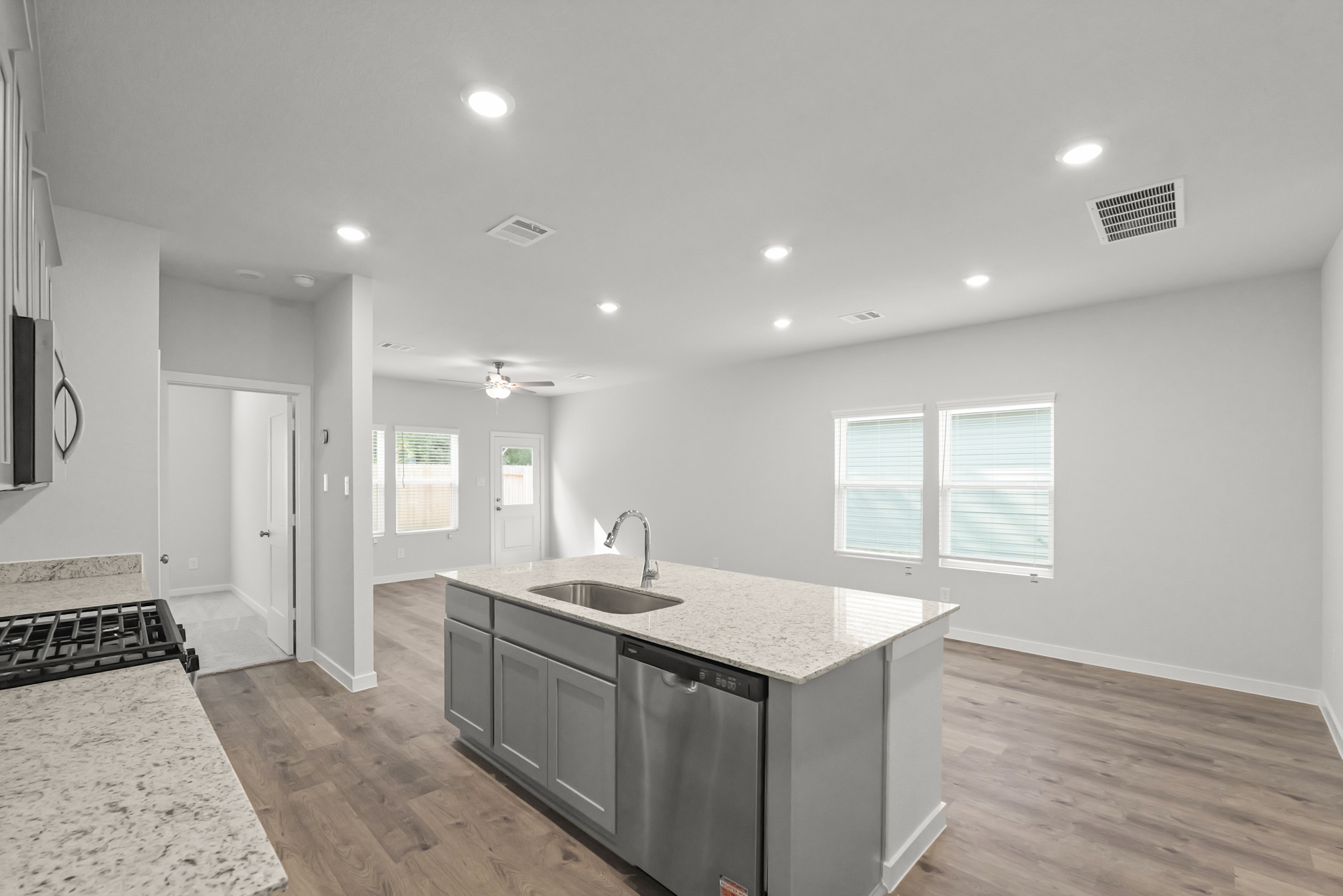 A kitchen with a marble countertop.