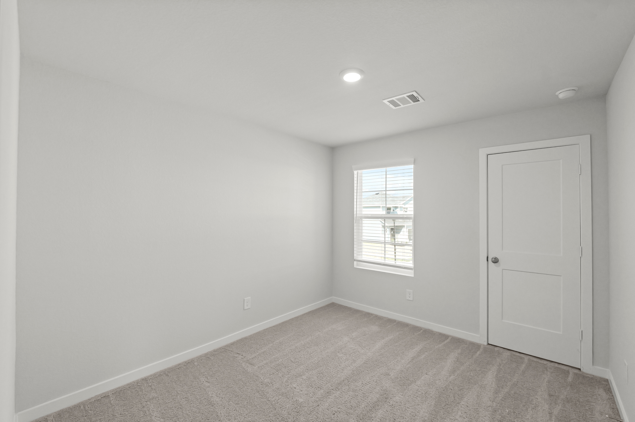 A room with a door and a window.