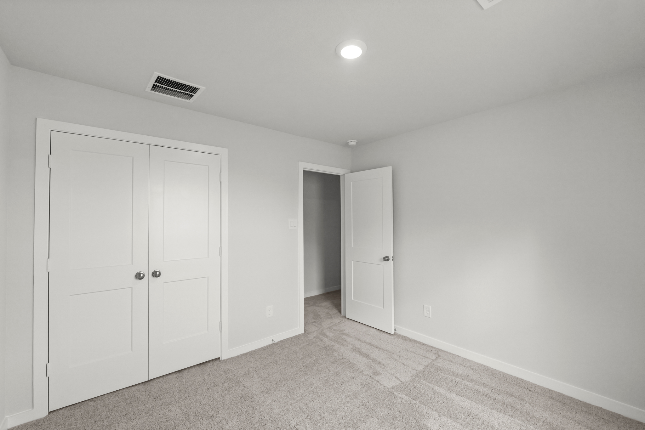 A room with white doors.