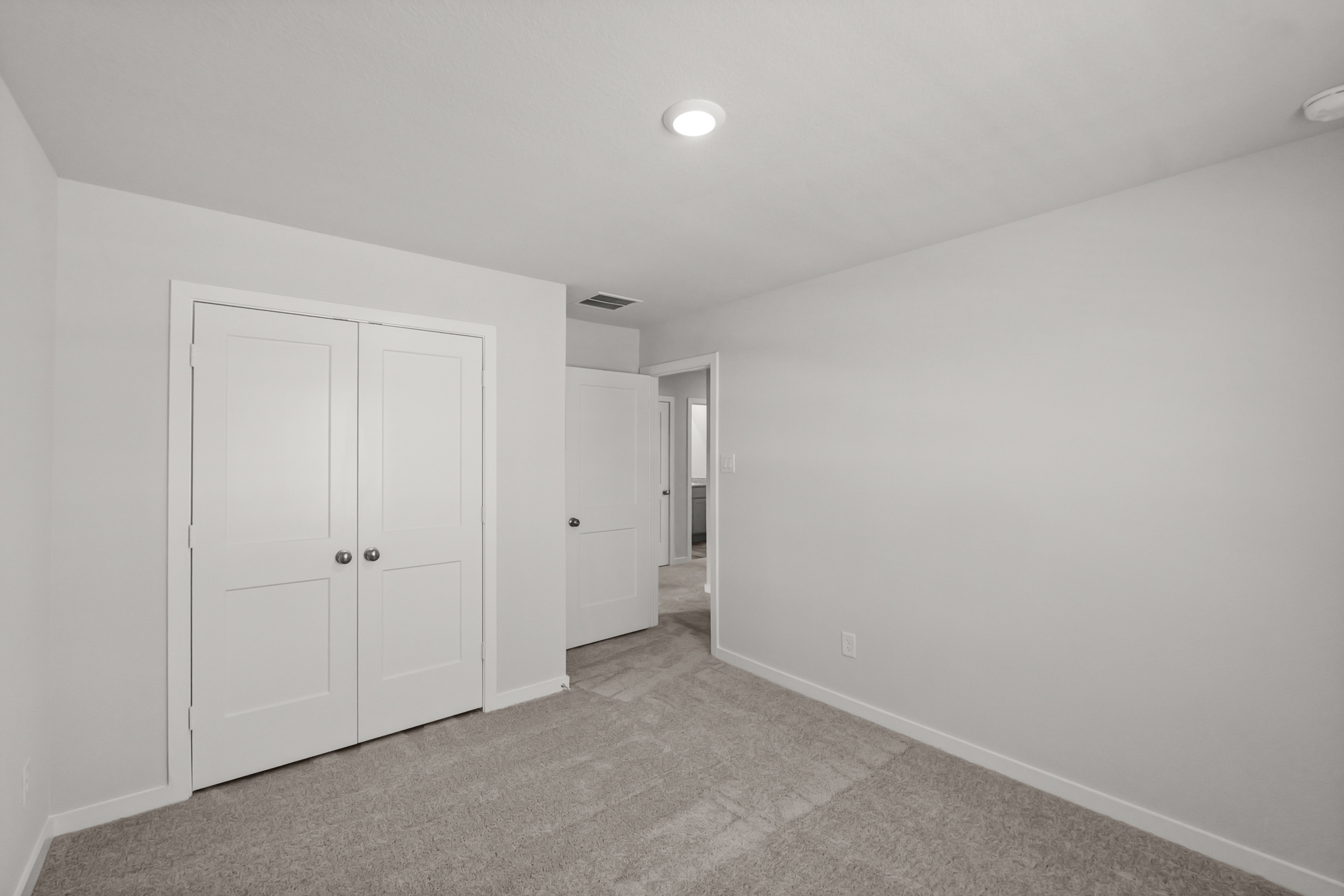 A room with white doors.