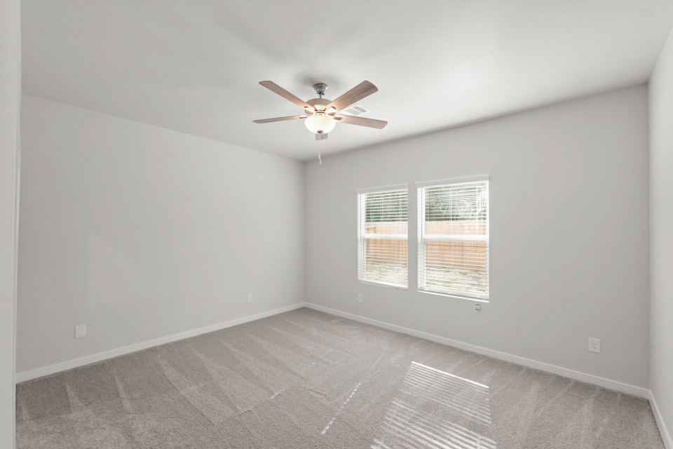 A ceiling fan in a room.