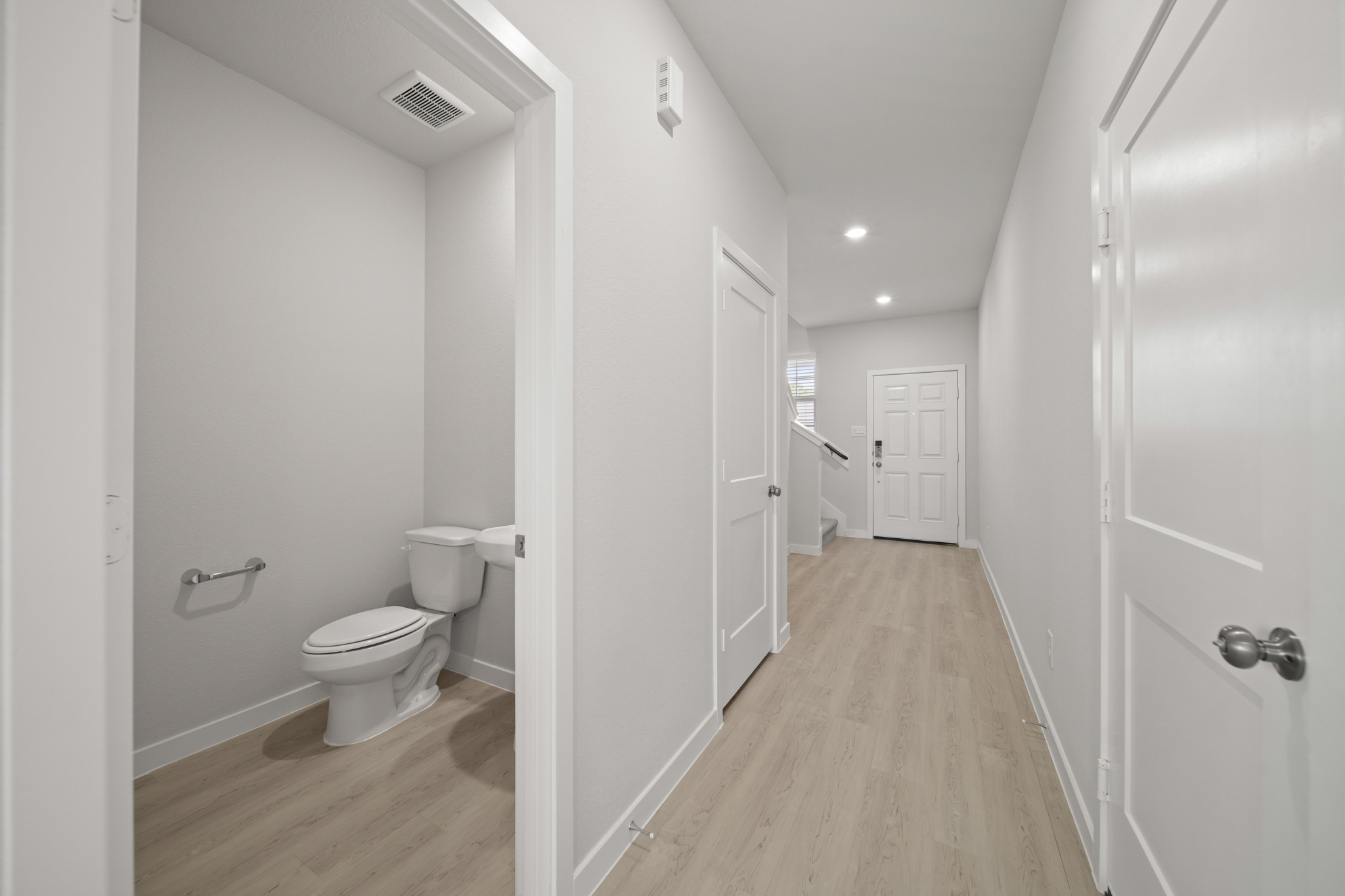 A bathroom with white walls.