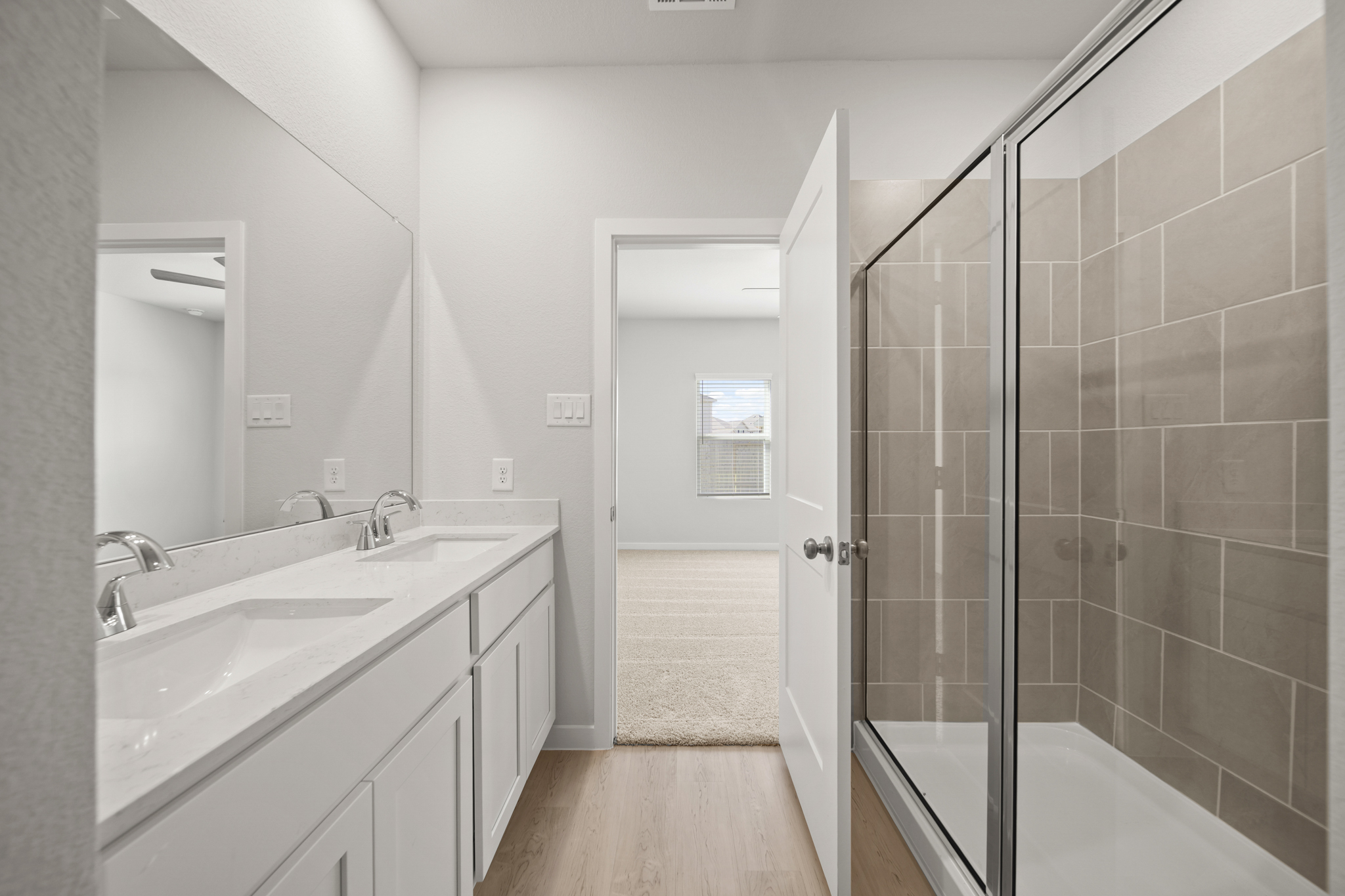 A bathroom with a glass shower.