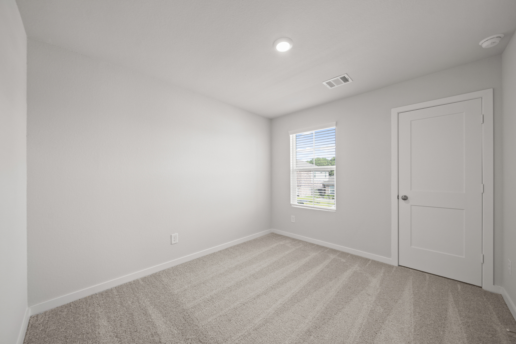 A room with a door and a window.