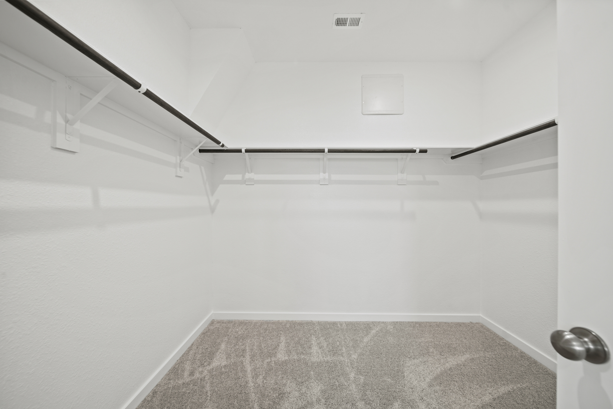 A staircase with a metal railing.