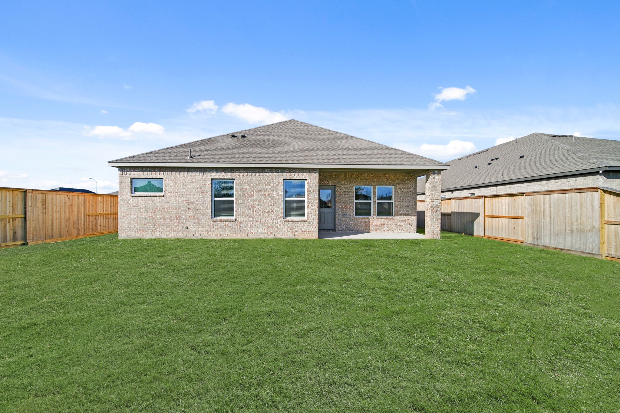 A house with a grass yard.