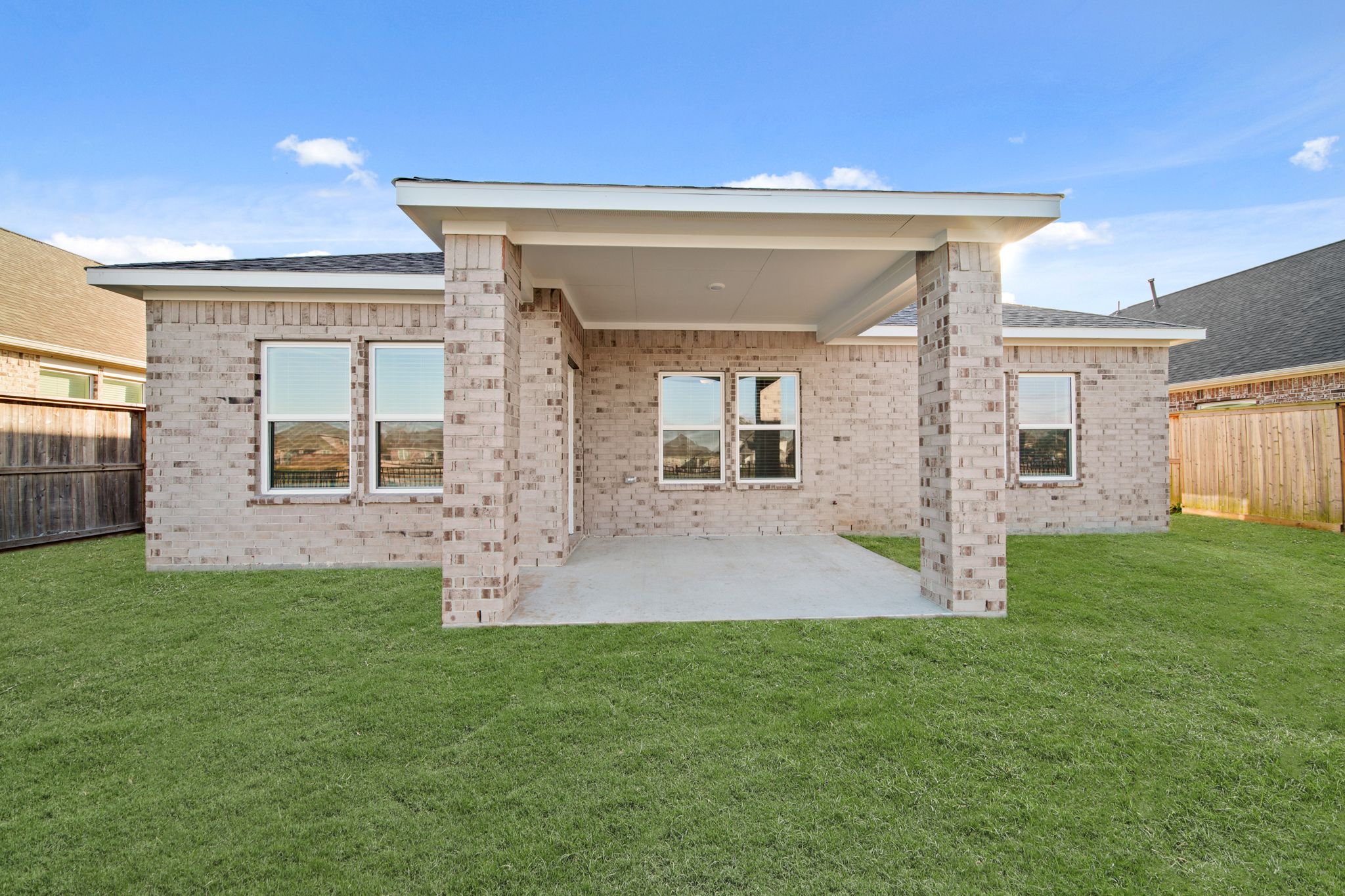 A house with a grass yard.