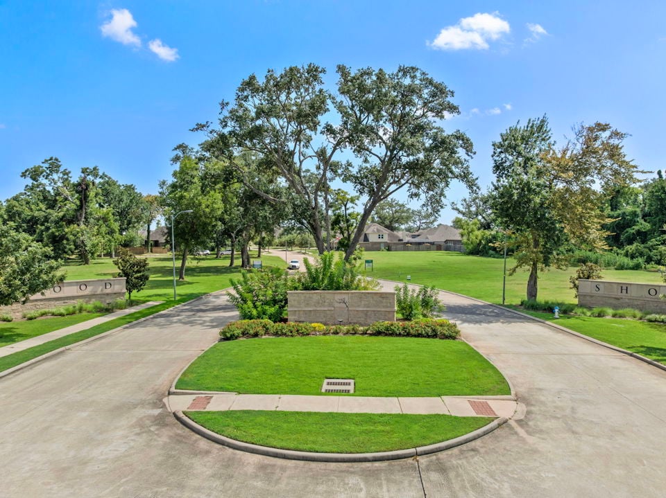 A park with a path and trees.