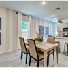 Hillshire model dining room and kitchen from Covington in San Antonio by Century Communities