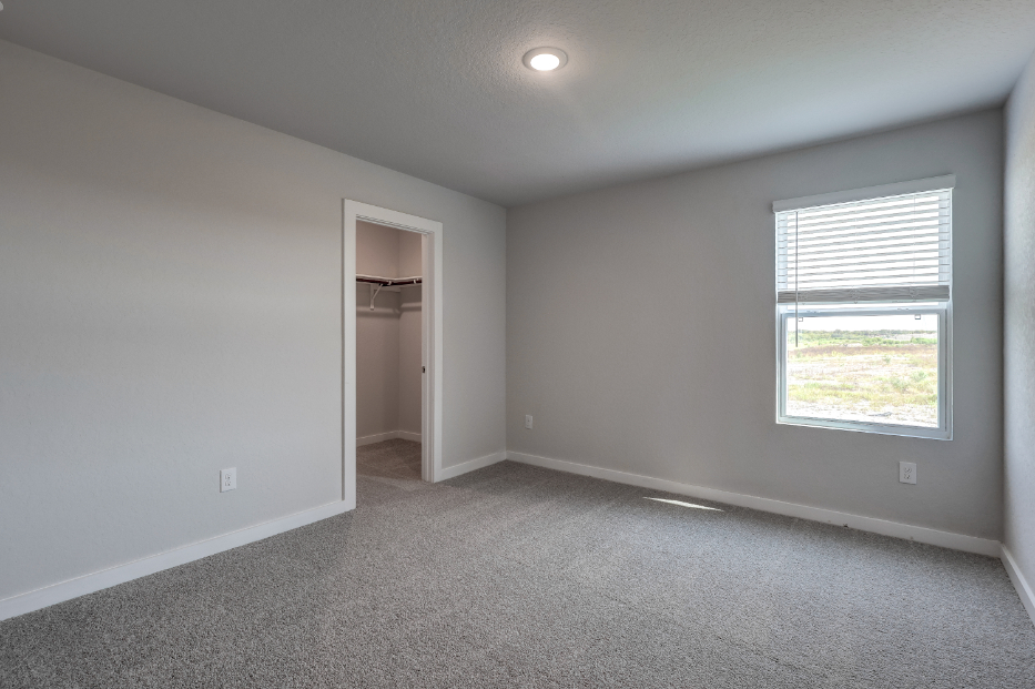 A room with a window and a door.