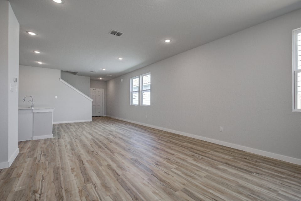 A room with a wood floor and a wood floor.