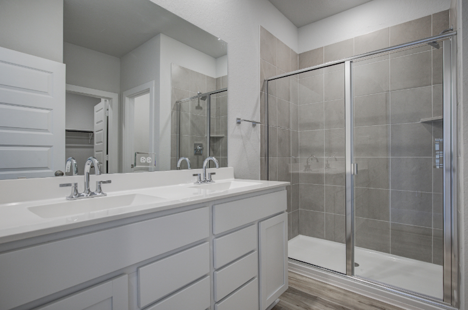 A bathroom with a glass shower.