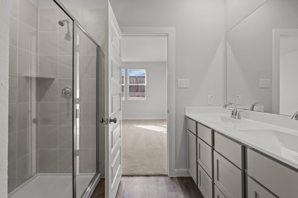 A bathroom with a glass shower.