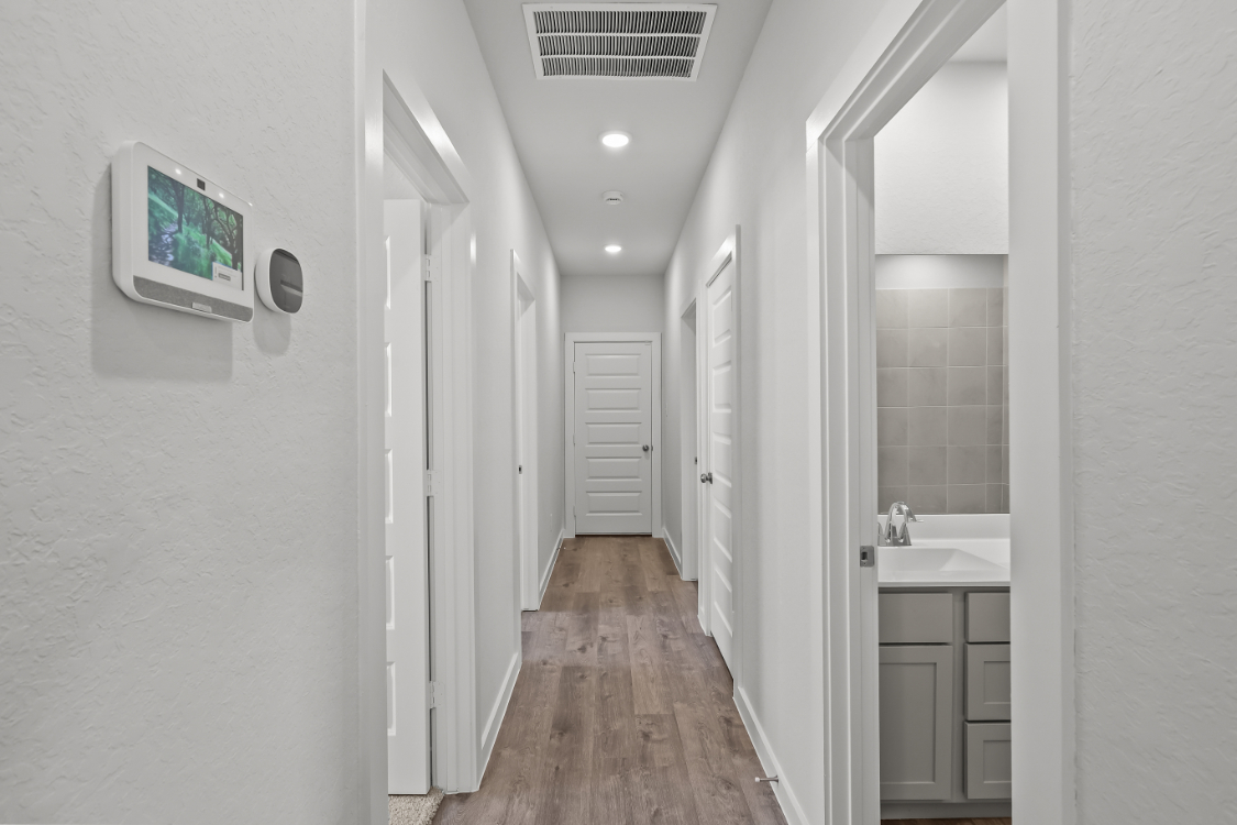 A hallway with white walls.