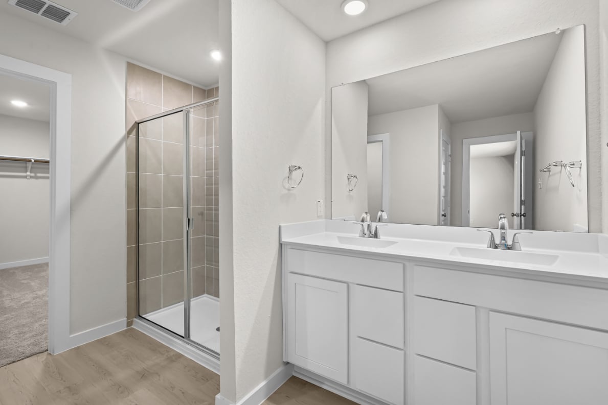 A bathroom with a glass shower.