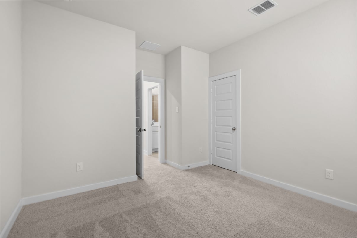 A hallway with white walls.