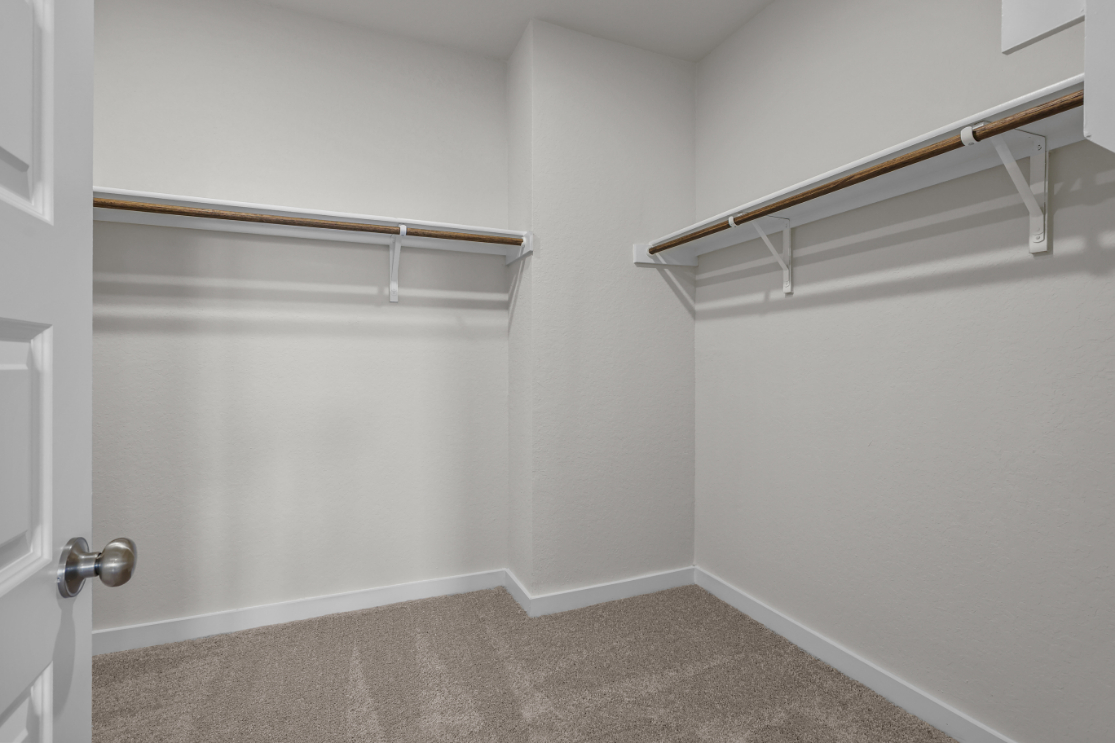 A white room with a metal railing.