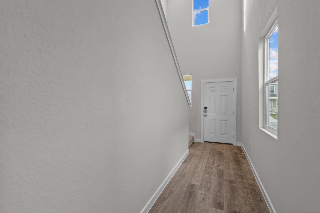 A hallway with white walls.